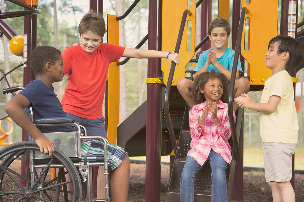 Smiling children playing on a playground